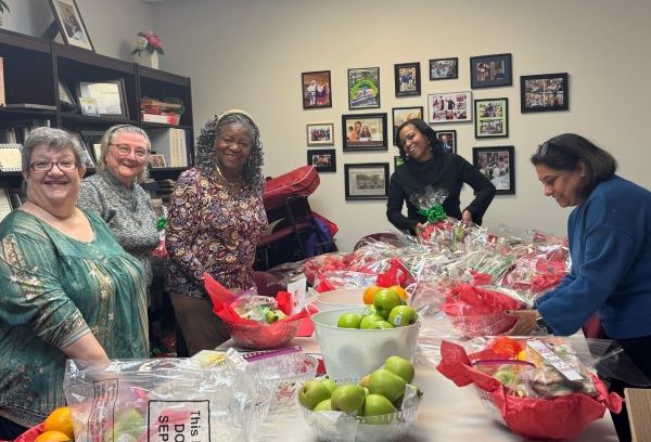 volunteer assembling Holiday baskets